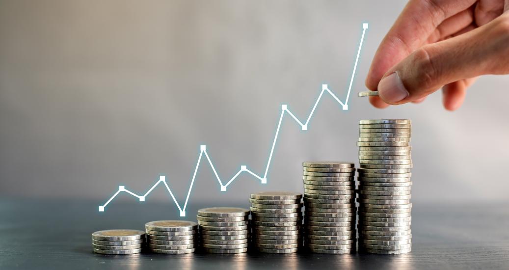 Hand stacking coins on black wooden table with profit line chart growth up. Business, finance, marketing, e-commerce concept and design